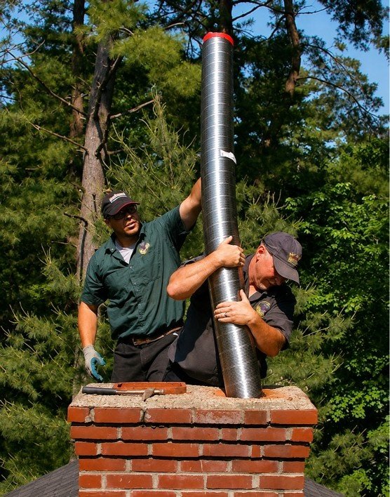 Gas and oil flue inspection service on a residential heating system in Manhasset Hills