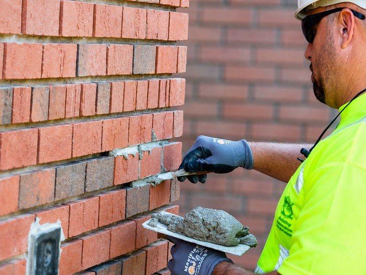 Chimney technician performing work on a home in Williston Park, NY