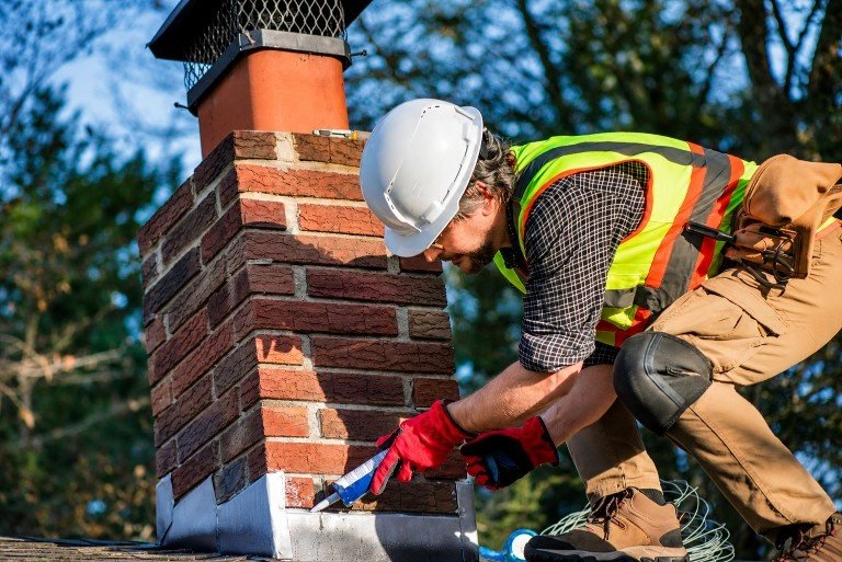 Rusted and gapped chimney flashing found during inspection in Manhasset Hills