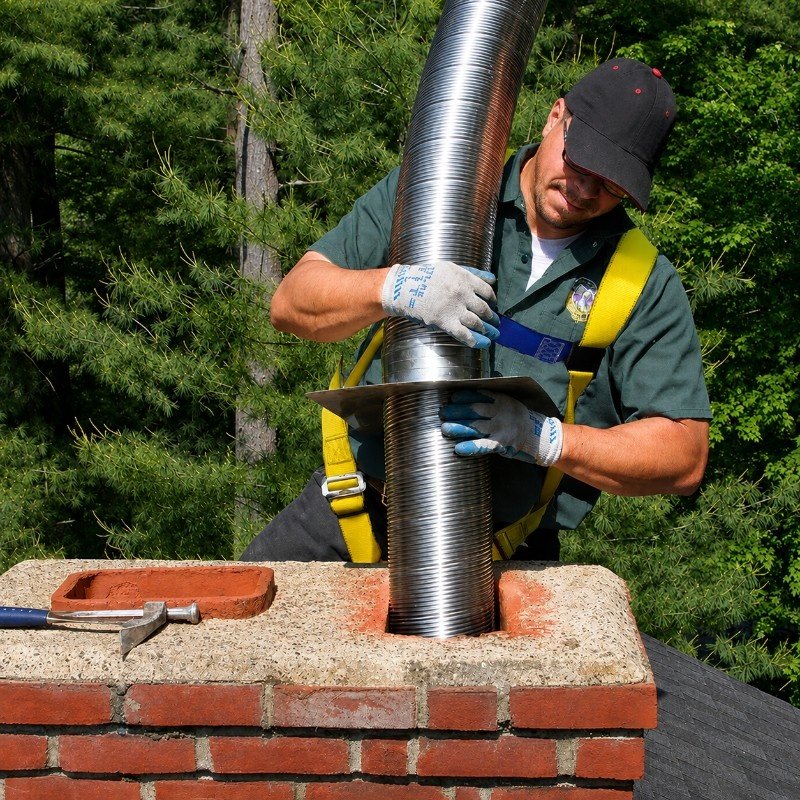 Chimney service technician working in North Hills, NY